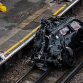 Three people were travelling in the Range Rover, which ended up on the tracks. Credit: Getty Images