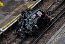 Three people were travelling in the Range Rover, which ended up on the tracks. Credit: Getty Images