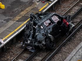 Three people were travelling in the Range Rover, which ended up on the tracks. Credit: Getty Images