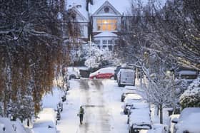 A man jogs along an icy road in London (Getty Images)
