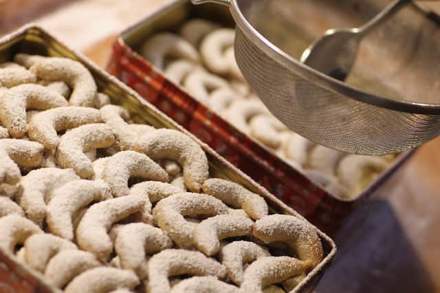 Half moon-shaped vanilla, powdered sugar-covered Christmas cookies, known as vanillekipferl. Photo: Getty
