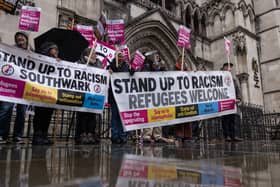 Campaigners against the Rwanda policy outside the Royal Courts of Justice