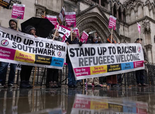 <p>Campaigners against the Rwanda policy outside the Royal Courts of Justice</p>