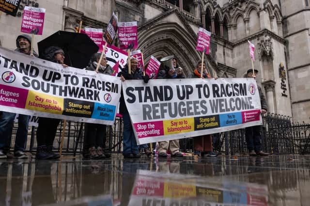 Campaigners against the Rwanda policy outside the Royal Courts of Justice