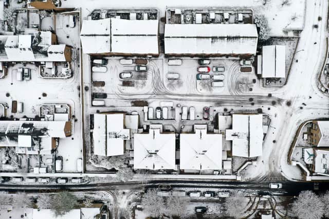 Snow covering the rooftops of houses and roads, in Wapping, east London. Photo: Getty