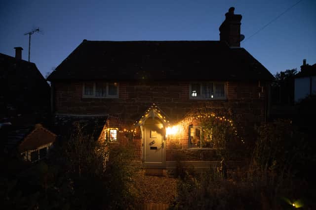 Christmas lights round the cottage door. Photo: SWNS