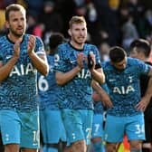 Tottenham Hotspur's English striker Harry Kane (2L) applauds fans on the pitch after the English Premier League football match between Brentford and Tottenham Hotspur at Gtech Community Stadium 