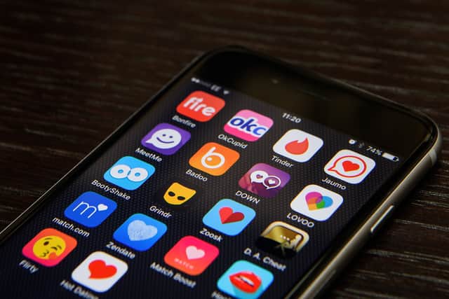 Dating app logos are seen on a mobile phone screen. Photo: Getty