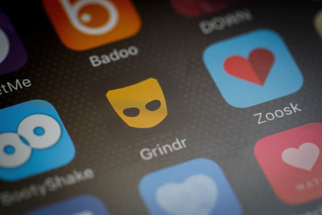 The ‘Grindr’ app logo is seen amongst other dating apps on a mobile phone screen. Photo: Getty