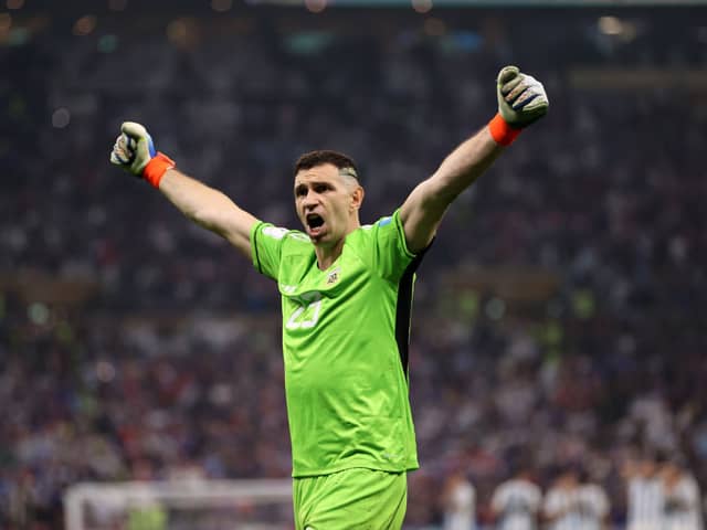 Emiliano Martinez of Argentina celebrates after saving the second penalty by Kingsley Coman of France during the FIFA World Cup  (Photo by Clive Brunskill/Getty Images)