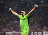 Emiliano Martinez of Argentina celebrates after saving the second penalty by Kingsley Coman of France during the FIFA World Cup  (Photo by Clive Brunskill/Getty Images)