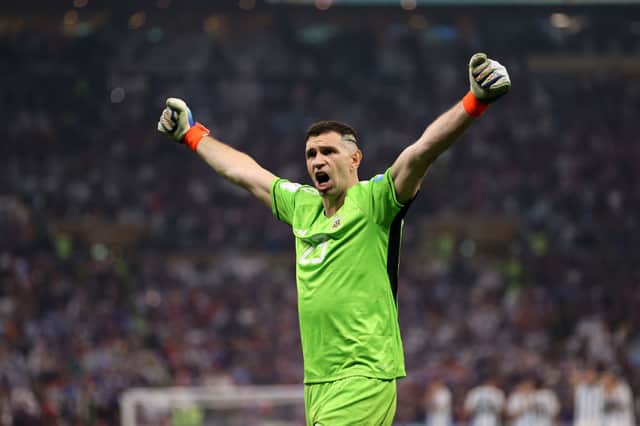 Emiliano Martinez of Argentina celebrates after saving the second penalty by Kingsley Coman of France during the FIFA World Cup  (Photo by Clive Brunskill/Getty Images)