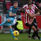 ottenham Hotspur's Swedish midfielder Dejan Kulusevski (L) has this shot saved during the English Premier League football match between Brentford and Tottenham Hotspur 