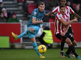 ottenham Hotspur's Swedish midfielder Dejan Kulusevski (L) has this shot saved during the English Premier League football match between Brentford and Tottenham Hotspur 