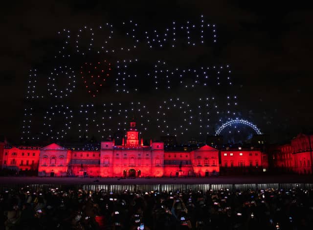 Drones spelled out "2023 with love from London" as fireworks exploded behind them