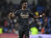 Bukayo Saka celebrates with the Arsenal fans after the Premier League match between Brighton & Hove Albion and Arsenal FC  (Photo by Stuart MacFarlane/Arsenal FC via Getty Images)
