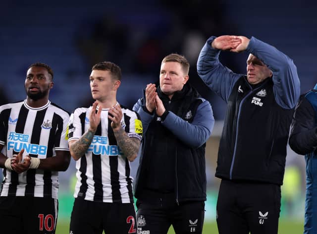 (L) Allan Saint-Maximin, Kieran Trippier (2L) and Eddie Howe (C), Manager of Newcastle United applauds fans following their side's victory