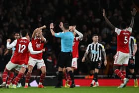 Arsenal players appeal to Referee Andy Madley during the English Premier League football match between Arsenal and Newcastle United at the Emirates Stadium
