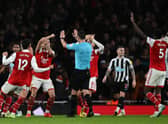 Arsenal players appeal to Referee Andy Madley during the English Premier League football match between Arsenal and Newcastle United at the Emirates Stadium