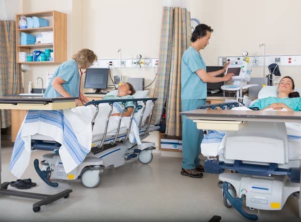 Nurses caring for patients in post operative care ward. Photo: AdobeStock