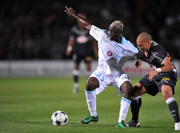 <p>(FILES) In this file photo taken on September 13, 2008 Girondin’s forward Yoan Gouffran (R) fights for the ball with with Marseille’s Cameroonian midfielder Modeste M’ Bami during the French L1 football match between Bordeaux and Olympique de Marseille, at the Chaban Delmas stadium in Bordeaux, southwestern France. - Cameroonian Modeste M’Bami, former midfielder for Paris Saint-Germain and Olympique de Marseille died aged 40 in Le Havre, announces sports agent Frank Belhassen, on January 7, 2023. (Photo by PIERRE ANDRIEU / AFP) (Photo by PIERRE ANDRIEU/AFP via Getty Images)</p>