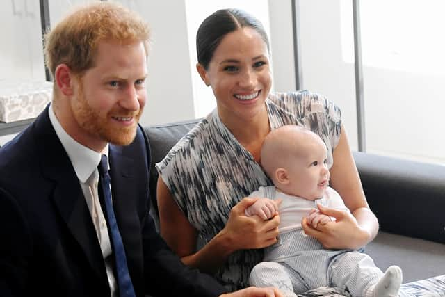 Prince Harry, Meghan Markle and their son Archie when he was a baby.