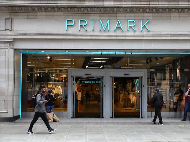 A pedestrian walks past a Primark store on Oxford Street.