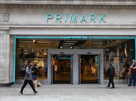 A pedestrian walks past a Primark store on Oxford Street.