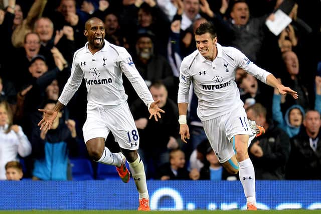 Jermain Defoe of Spurs celebrates with teammate Gareth Bale (R) after scoring his team's second goal during the Barclays Premier League 