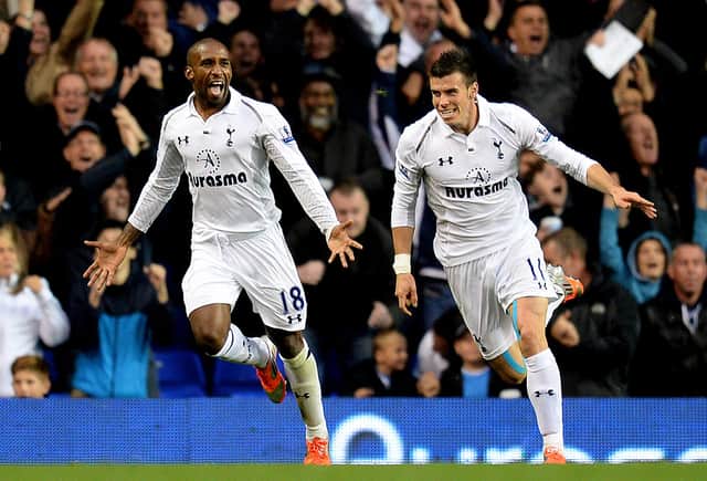 Jermain Defoe of Spurs celebrates with teammate Gareth Bale (R) after scoring his team's second goal during the Barclays Premier League