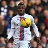 Crystal Palace’s Ivorian striker Wilfried Zaha keeps his eyes on the ball during the English Premier League football match between (Photo by BEN STANSALL/AFP via Getty Images)