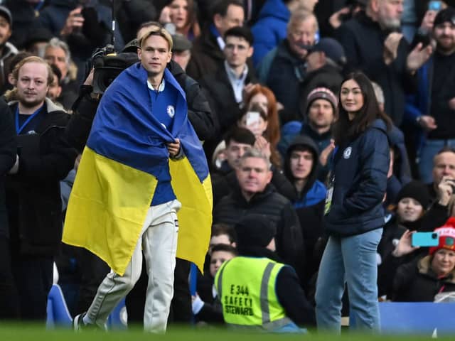 Chelsea's Ukrainian midfielder Mykhailo Mudryk is introduced to the crowd at half-time in the English Premier League football match (Photo by BEN STANSALL/AFP via Getty Images)