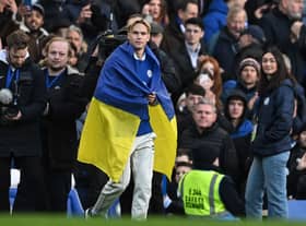 Chelsea's Ukrainian midfielder Mykhailo Mudryk is introduced to the crowd at half-time in the English Premier League football match (Photo by BEN STANSALL/AFP via Getty Images)