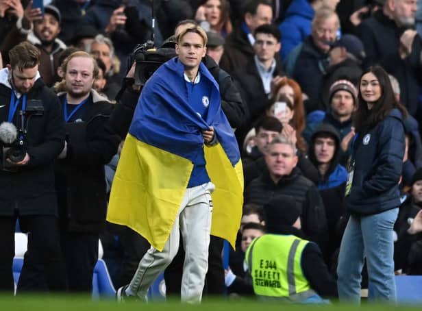 <p>Chelsea's Ukrainian midfielder Mykhailo Mudryk is introduced to the crowd at half-time in the English Premier League football match (Photo by BEN STANSALL/AFP via Getty Images)</p>