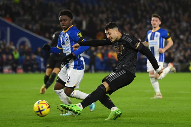 Gabriel Martinelli of Arsenal crosses the ball under pressure from Tariq Lamptey of Brighton & Hove Albion  (Photo by Mike Hewitt/Getty Images)