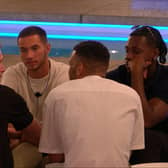 The male islanders talking about the game, just before the drama erupted. (Photo by ITV)