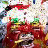 Chinese folk artists perform the lion dance at a temple fair to celebrate the Lunar New Year of the Dragon in 2022 (Photo: Feng Li/Getty Images)
