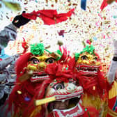 Chinese folk artists perform the lion dance at a temple fair to celebrate the Lunar New Year of the Dragon in 2022 (Photo: Feng Li/Getty Images)