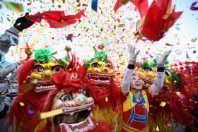 Chinese folk artists perform the lion dance at a temple fair to celebrate the Lunar New Year of the Dragon in 2022 (Photo: Feng Li/Getty Images)