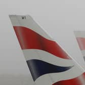 LONDON - DECEMBER 22:  Tail fins of British Airways aircraft are seen through fog at Heathrow Airport on December 22, 2006 in London, England