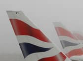 LONDON - DECEMBER 22:  Tail fins of British Airways aircraft are seen through fog at Heathrow Airport on December 22, 2006 in London, England