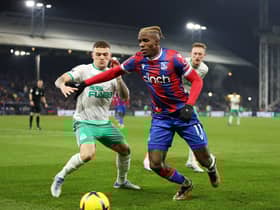  Kieran Trippier of Newcastle United battles for possession with Wilfried Zaha of Crystal Palace during the Premier League match (Photo by Richard Heathcote/Getty Images)
