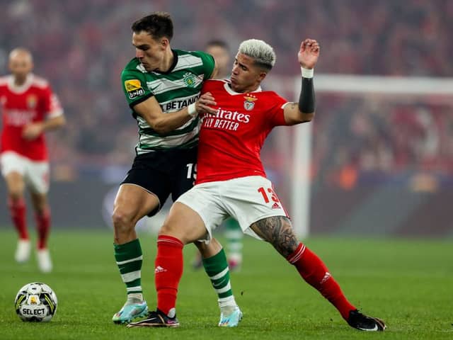 Enzo Fernandez (R) vies with Sporting's Uruguayan midfielder Manuel Ugarte during the Portuguese League football match between SL Benfica and Sporting CP 
