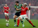 Enzo Fernandez (R) vies with Sporting's Uruguayan midfielder Manuel Ugarte during the Portuguese League football match between SL Benfica and Sporting CP 