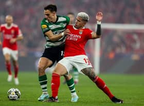 Enzo Fernandez (R) vies with Sporting's Uruguayan midfielder Manuel Ugarte during the Portuguese League football match between SL Benfica and Sporting CP 