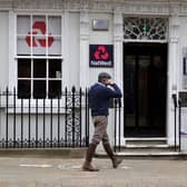 Customers use a NatWest bank on the High Street in Winchester, south west England on March 31, 2021. (Photo by ADRIAN DENNIS / AFP) (Photo by ADRIAN DENNIS/AFP via Getty Images)