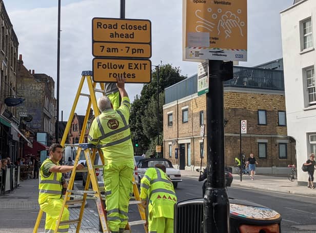 <p>Traffic restriction signs going up in Stoke Newington’s Church Street in 2021</p>