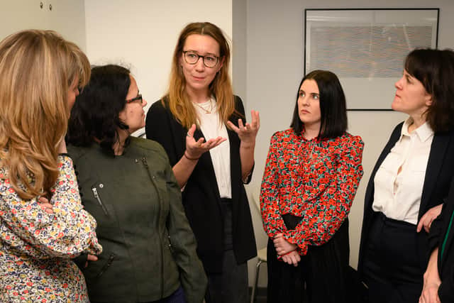Kate Sanger, from charity Jo’s Cervical Cancer Trust, centre, speaks during a visit by Labour politicians to Victoria Medical Centre. Photo: Getty