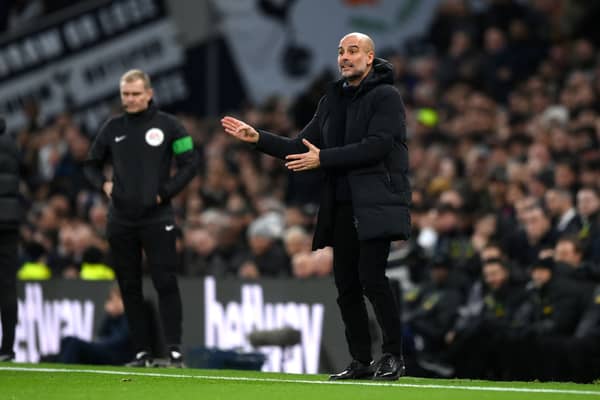 Pep Guardiola, Manager of Manchester City, gives the team instructions during the Premier League match between Tottenham Hotspur and Manchester City 