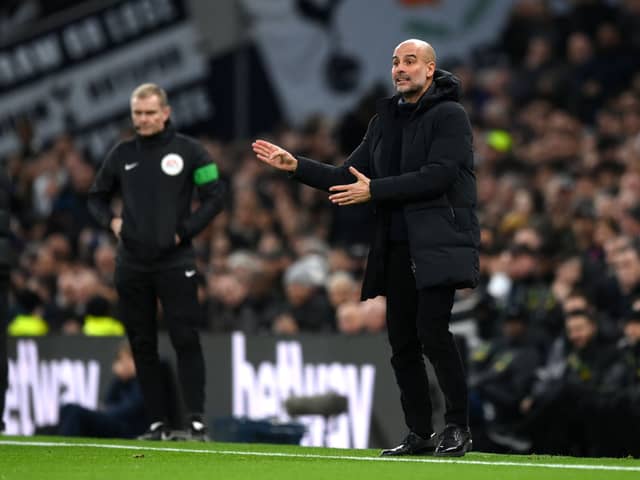 Pep Guardiola, Manager of Manchester City, gives the team instructions during the Premier League match between Tottenham Hotspur and Manchester City 